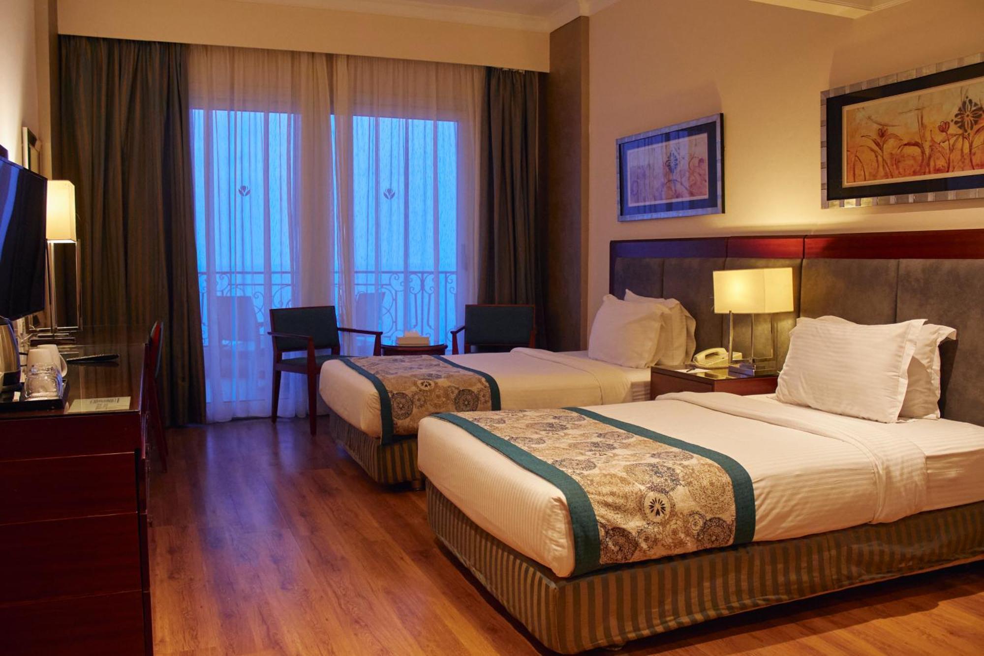 Tolip Hotel Александрия Екстериор снимка A room at the hotel
